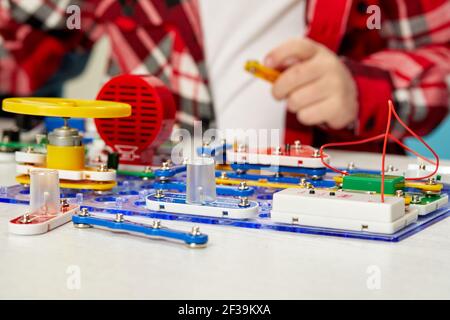 children playing with electronic constructor at studio Stock Photo