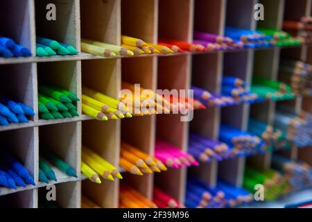 Showcase with colored pencils for drawing in the store for artists or stationery Art concept background Stock Photo