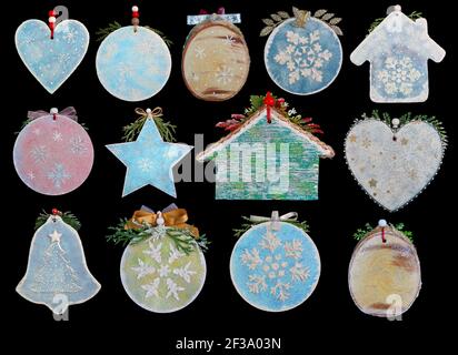 Homemade Christmas tree decoration objects  made of wood, plaster and glitters. Isolated on black set Stock Photo