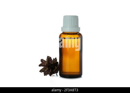 Pine essential oil in a glass bottle isolated on white background, natural aromatherapy cut out Stock Photo