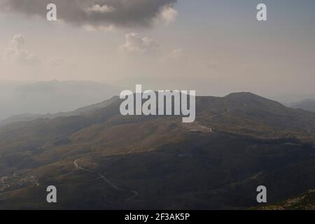 Mountain landscape of highland and meadows with contrast from shadows of the clouds Stock Photo
