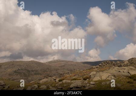 Mountain landscape of highland and meadows with contrast from shadows of the clouds Stock Photo