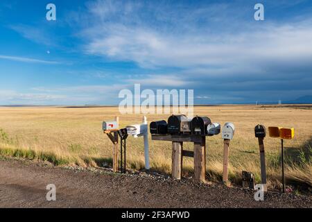 Colorado, USA - July 10, 2014: Mailboxes by a road in a rural area of the State of Colorado, USA. Stock Photo