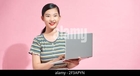 Portrait of her she nice attractive pretty focused cheerful lady IT specialist holding in hands laptop Stock Photo