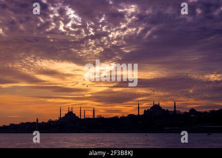 Silhouette of Hagia Sophia and Sultanahmet Mosque in the sky during sunset in Istanbul Turkey Stock Photo