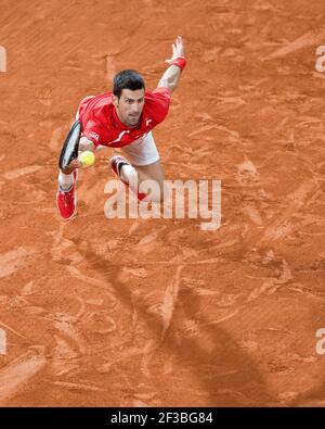 Serbian tennis player Novak Djokovic playing a forehand volley during French Open 2020, Paris, France, Europe. Stock Photo