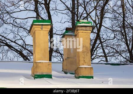 yellow pipes on the roof of an apartment building. winter season. Heating season. High quality photo Stock Photo