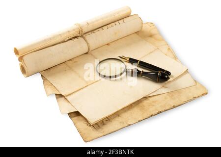 Fountain pen and magnifying glass with old sheets isolated  on white background Stock Photo