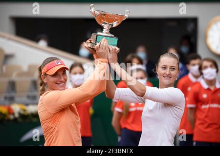 Hungarian tennis player Timea Babos and French player Kristina Mladenovic holding trophy after winning Women's Doubles Championships, French Open 2020 Stock Photo