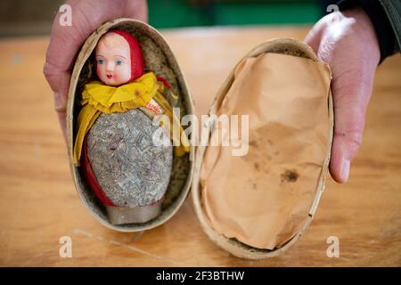 A rare 97-year-old Pascall's Easter egg which is set to go on display at a museum after it sold for ??800 when it went up for auction at Hansons' Etwall saleroom, near Derby, on March 12. The near-century-old chocolate gift, wrapped up as a doll inside an egg-shaped decorative casing, was bought by Torquay tourist attraction Bygones. Picture date: Tuesday March 16, 2021. Stock Photo