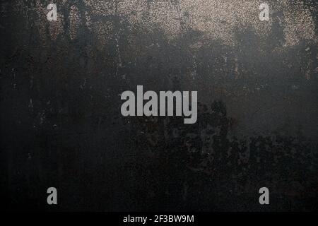 Worn out rusted black metal texture grunge background Stock Photo