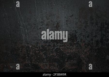 Worn out rusted black metal texture grunge background Stock Photo