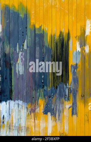 Old yellow metallic sheet with paint stains, grunge background or texture Stock Photo