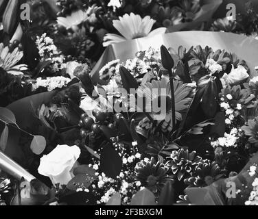 Flower bouquets background. Sadness concept. Black and white photo. Stock Photo