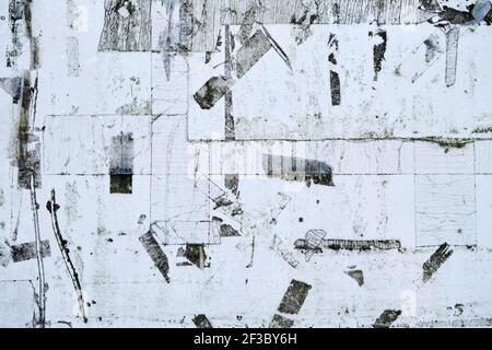 Old bulletin board wall with adhesive rests, grunge background or texture Stock Photo