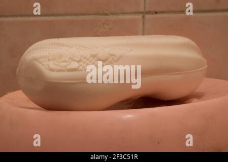 White hand washing soap bar with beautiful flower design on it. Stock Photo