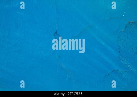 Detail of old blue painted wall with cracking paint Stock Photo