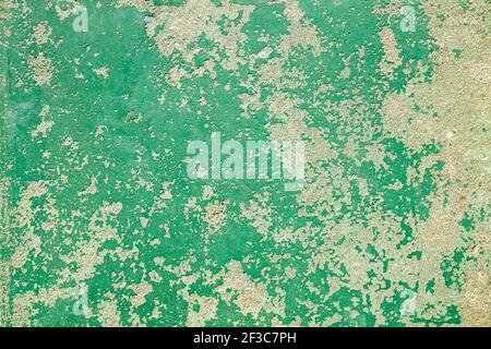 Old wall with green peeling paint grunge background or texture Stock Photo