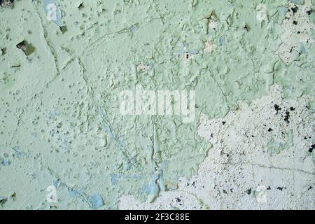 Old wall with green peeling paint, grunge background or texture Stock Photo