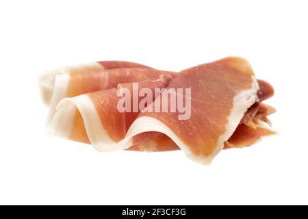 Slice of Italian prosciutto crudo or jamon. Raw ham. Isolated on white background Stock Photo