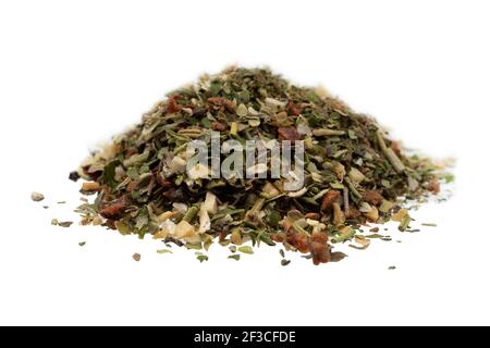 Pile of dried spices, isolated on white background. Garlic fennel carrots basil celery, parsley, marjoram, onion. Stock Photo