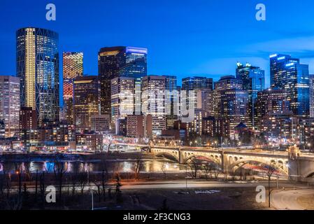 Calgary skyline at night with Bow River and Centre Street Bridge ...