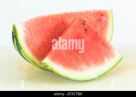 Watermelon slices or water melon wedges on a chopping board, UK Stock Photo