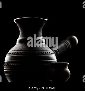 Traditional black clay cezve for brewing coffee Stock Photo