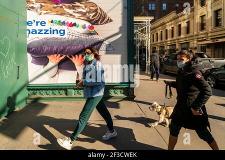 New York, USA. 13th Mar, 2021. Masked shoppers in the Chelsea neighborhood of New York on Saturday, March 13, 2021. (Photo by Richard B. Levine) Credit: Sipa USA/Alamy Live News Stock Photo