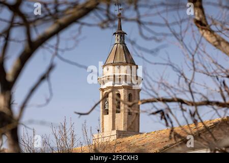 Photograph of the bell tower of the church of Santa Maria, of late Gothic architectural style, in the small town of Bulbuente, in the Campo de Borja r Stock Photo