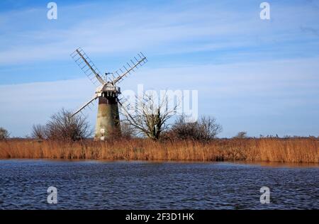 A view of St Benet's Level Drainage Mill on Horning Marshes by the River Thurne viewed from Thurne, Norfolk, England, United Kingdom. Stock Photo