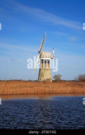 A view of St Benet's Level Drainage Mill on Horning Marshes by the River Thurne viewed from Thurne, Norfolk, England, United Kingdom. Stock Photo