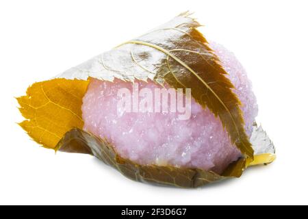 traditional Japanese dessert sakura mochi made of pink rice with bean paste wrapped in salted cherry leaf Stock Photo