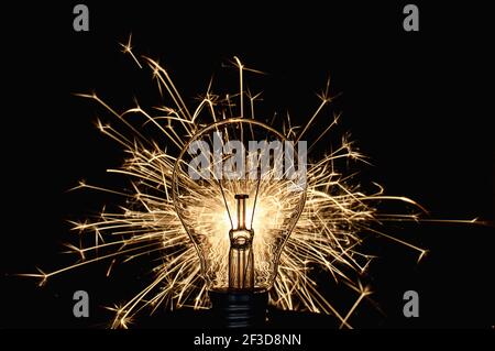Glowing light bulb in the dark. (CTK Photo/Petr Malina) Stock Photo