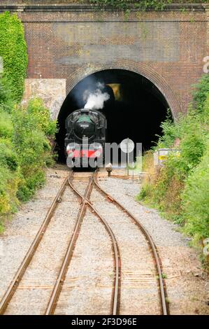 LMS Black Five No 44932 emerging from Kemble tunnel with the Cathedrals Express to Gloucester, slowing for a scheduled water stop. 12.08.2010. Stock Photo