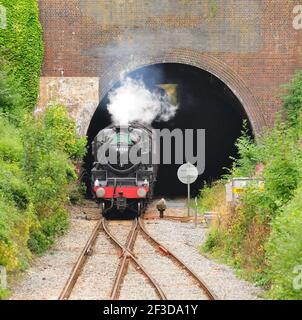 LMS Black Five No 44932 emerging from Kemble tunnel with the Cathedrals Express to Gloucester, slowing for a scheduled water stop. 12.08.2010. Stock Photo