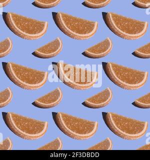 Decorative seamless candy pattern made of marmalade in the shape of a slice of citrus fruit. Jelly sweet candies. Beautiful wide-angle wallpaper or we Stock Photo