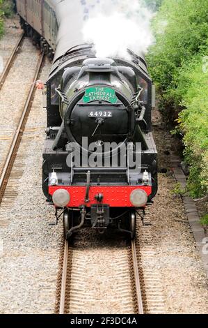 LMS Black Five No 44932 emerging from Kemble tunnel with the Cathedrals Express to Gloucester, slowing for a scheduled water stop. 12.08.2010. Stock Photo