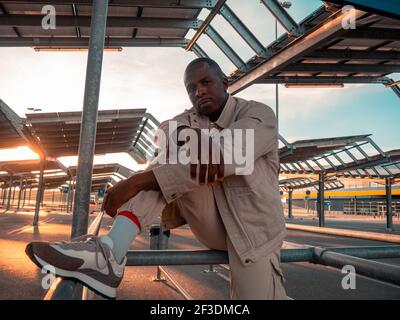 A handsome black Spanish male posing in the parking lot Stock Photo