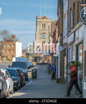 Pinner High Street, the centre of Pinner Village, with retail shops & St. John’s Parish Church in background. Harrow, Northwest London, England UK. Stock Photo