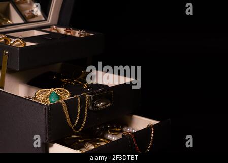 open jewelery box full on black background Stock Photo