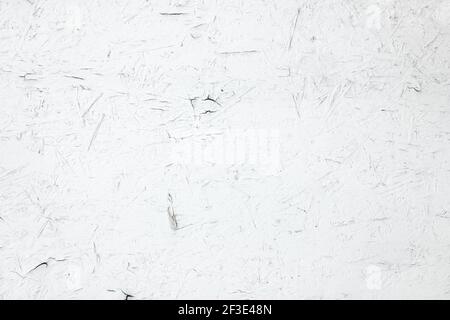 White painted plywood panel with peeling paint Stock Photo