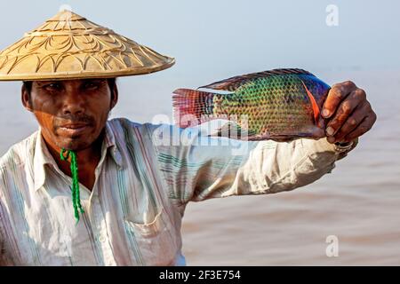 The fisherman shows a caught fish, Inle Lake, Myanmar Stock Photo