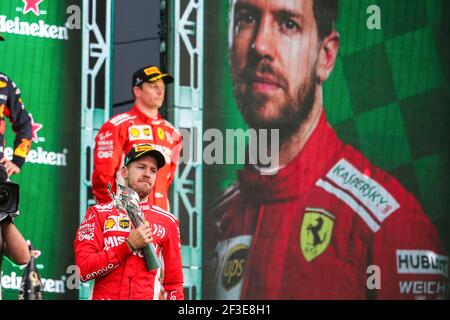 The podium (L to R): Sebastian Vettel (GER) Ferrari, second; Lewis ...