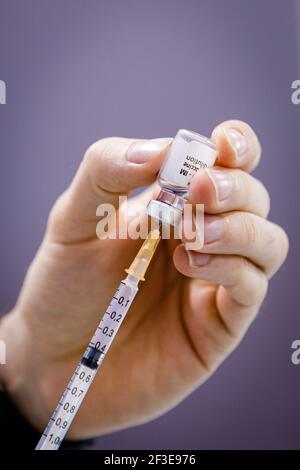 Bologna, Italy. 16th Mar, 2021. Despite the stop to use of the Astrazeneca vaccine in Italy and in other European countries, vaccinations with Pfizer/BioNTech continued as scheduled inside at the vaccine hub at the Bologna fair. Credit: Massimiliano Donati/Alamy Live News Stock Photo