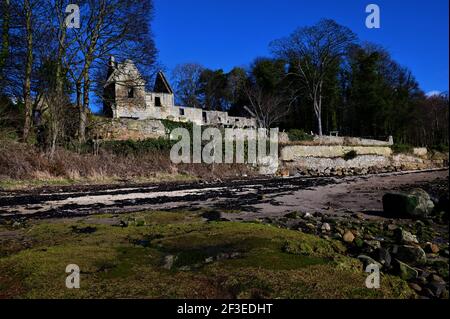 A view of the ruins of the medieval stone church building of St. Bridgets on the shoreline at Dalgety Bay in Fife. Stock Photo