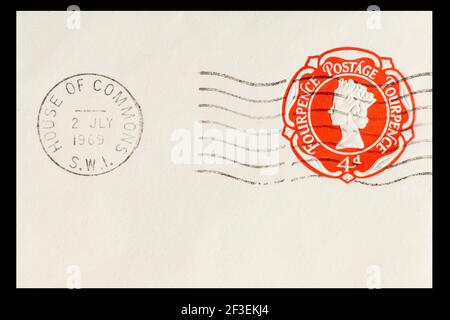 Vintage cancelled prepaid 4d postage stamp from Great Britain. Dated 2nd July 1969 and posted in the House of Commons. Clear red print in fine detail Stock Photo