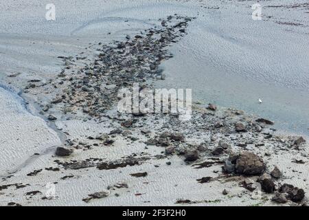 Abstract pattern at low tide in Fresnaye Bay at Cap Frehel France Europe Stock Photo