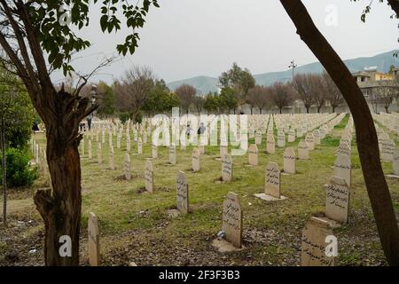 Halabja, Iraq. 16th Mar, 2021. A view of the grave yard where the victims of the Halabja chemical attack were buried.The 33rd anniversary of the chemical attack carried out by the Iraqi government on March 16, 1988 on the city of Halabja in the Kurdistan Region, which killed nearly 5000 people and injured 10000 most of them civilians. Thousands of the city's residents died in the year following the attack due to health complications and due to diseases and birth defects. (Photo by Ismael Adnan/SOPA Images/Sipa USA) Credit: Sipa USA/Alamy Live News Stock Photo