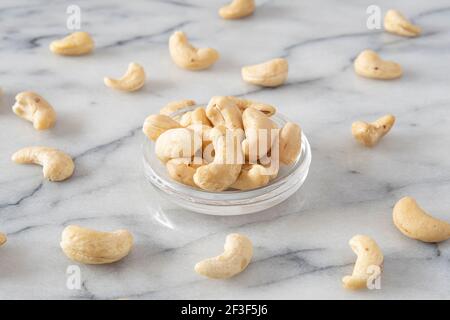 Close-up of cashew nuts in a transparent saucer Stock Photo